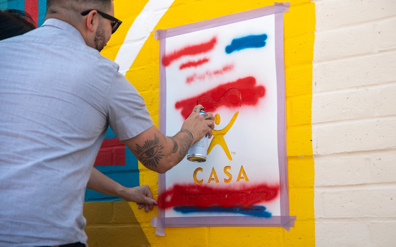 Mural of Hope_Painting the CASA Logo onto the Mural
